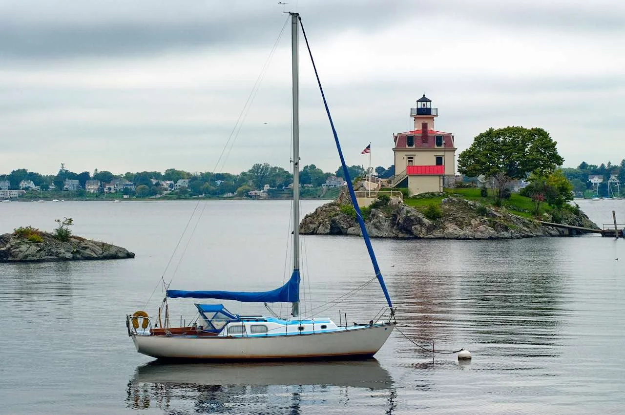 Living off the grid in Rhode Island is difficult due to building code requirements for water, electricity, heating, and water heater.