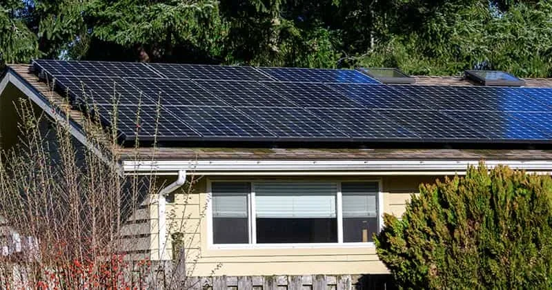 Living off the grid in Rhode Island is difficult due to building code requirements for water, electricity, heating, and water heater.